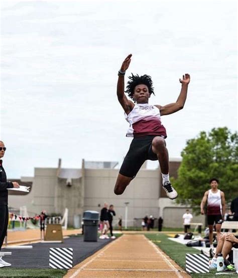 HHS alum meets student who broke his 52-year-old long-jump record