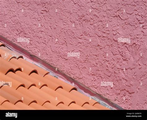 Pink wall and terra cotta roof tiles as color abstract Stock Photo - Alamy