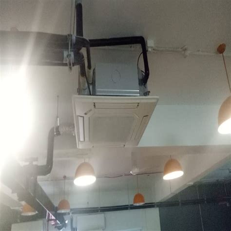 Cassette unit installed in open ceiling pattern commercial space | homify