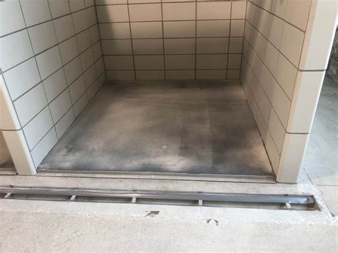 The concrete is being poured for the dog kennel floors at the animal ...