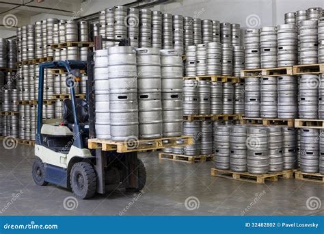 Forklift loading beer kegs stock photo. Image of loader - 32482802