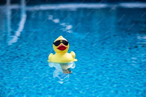 Premium Photo | Funny rubber duck floating in a pool