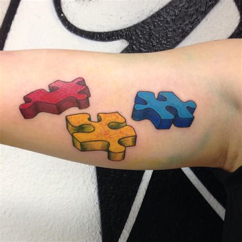 Autism Puzzle Piece Tattoo Behind The Ear