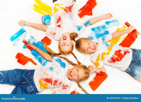 Three Little Kids Lay on the Floor and Laugh Stock Photo - Image of ...