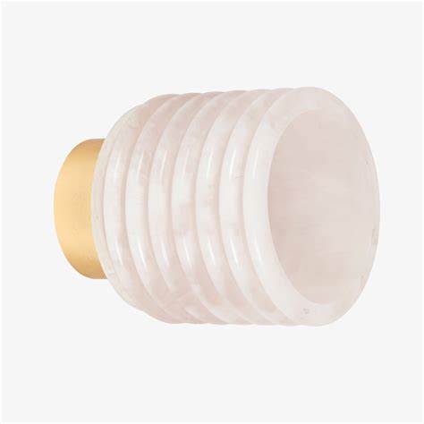 Ribbed stone wall lamp shade with brass backplate, modern wall light design