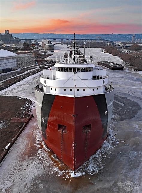 The warm glow of the setting sun and the Arthur M. Anderson at Fraser ...