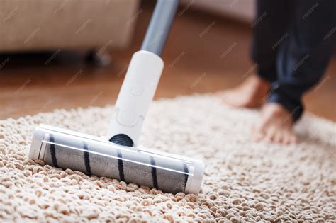 Powerful cordless vacuum cleaner with white cyclonic dust collection ...