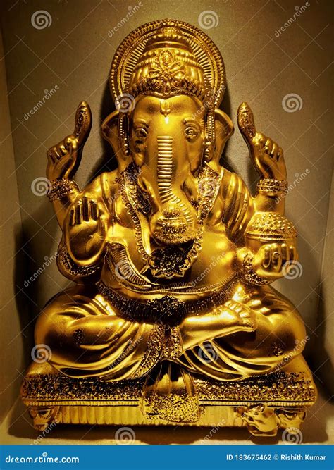 Golden Idol of Lord Ganesha. Stock Photo - Image of lord, yellow: 183675462