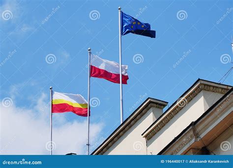 White-yellow-red, Red-white and Blue Flags Against the Blue Sky on the ...