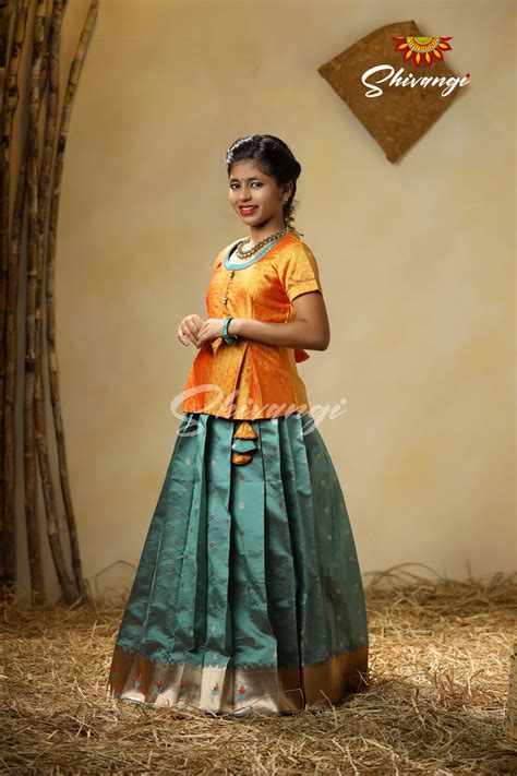 Pattu Pavadai designs in Semi Silk in Green - Pepper Flower