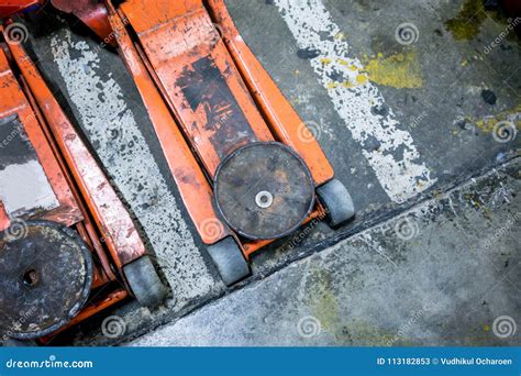 Used Orange Hydraulic Floor Jacks on Concrete Floor Stock Image - Image ...