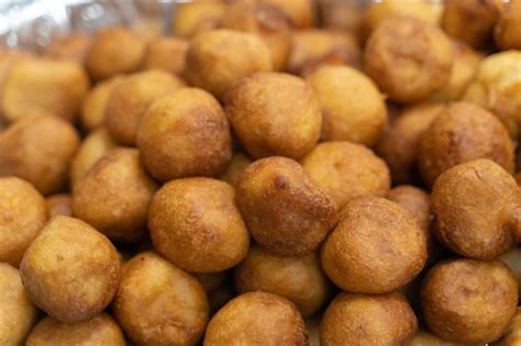 Pile of nigerian puff puff served at party | Premium Photo