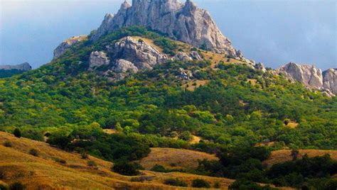 Download wallpaper 960x544 mountains, rock, trees, relief playstation ...