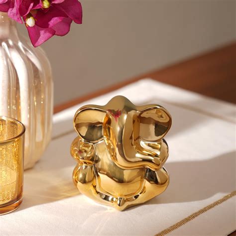 Buy PURE HOME + LIVING Gold Sitting Ceramic Ganesha Figurine Online at ...