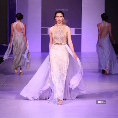 Models showcase a creation by designer Sulakshana Monga during a ...