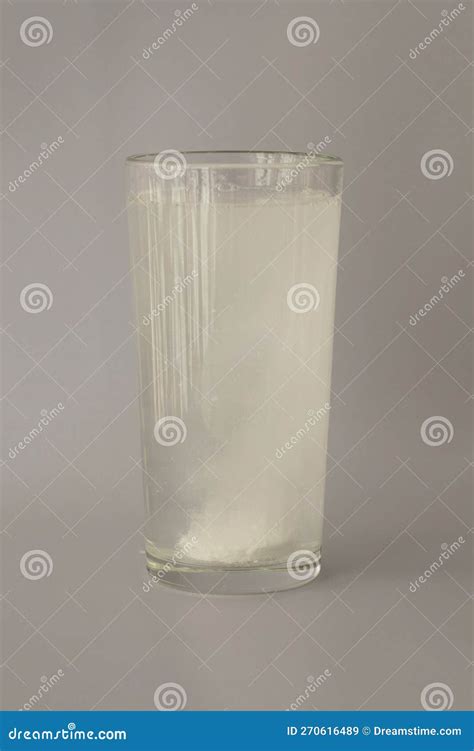 The Fizzy Round White Tablet is Dissolved in a Glass of Water ...