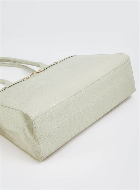 Buy Women Textured Shoulder Bag Online at just Rs. 1299.0 ...