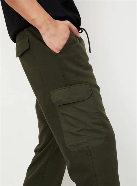 Buy Men Solid Athleisure Cargo Joggers Online at just Rs. 1199.0 ...