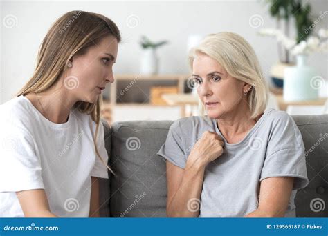Concerned Aged Mom and Adult Daughter Talk at Home Stock Image - Image ...