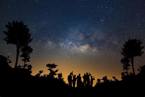 Landscape with milky way, Night sky with stars and silhouette of happy ...
