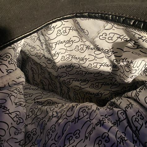 Vintage black Ed Hardy bag/purse, the inside has a... - Depop
