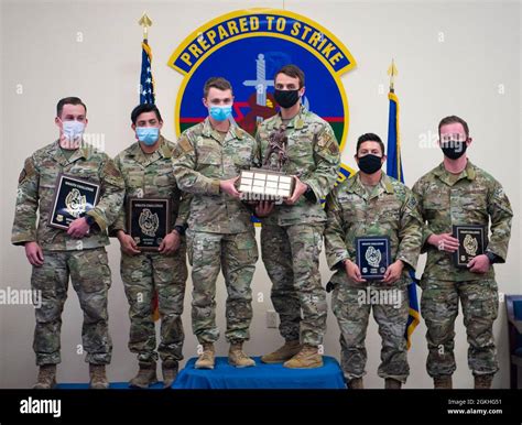 (Middle left) Airman 1st Class Robert Lowry and (middle right) 1st Lt ...