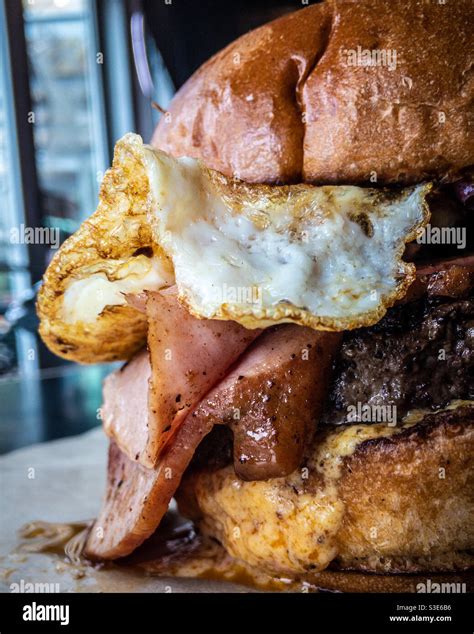 Hamburger with egg, bacon and cheese Stock Photo - Alamy
