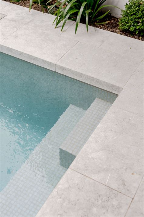 Luxurious Limestone Pool Steps and Paving for Your Ultimate Relaxation