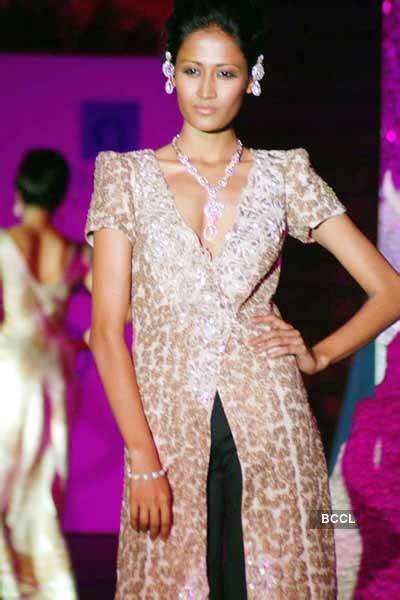 A model showcases a creation during 'Orra' jewellery show at Grand ...