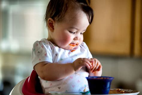 Babies Eating First Solids 的图像结果