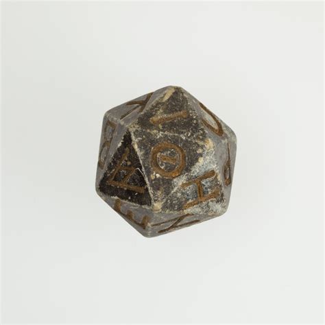 Twenty-sided die (icosahedron) with faces inscribed with Greek letters ...