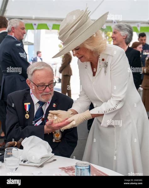 Queen Camilla gives veteran Alan Kennett "the King's shilling", two 5p ...