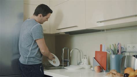 Happy Man Washing Dirty Dishes With Soap Stock Footage SBV-337774080 ...