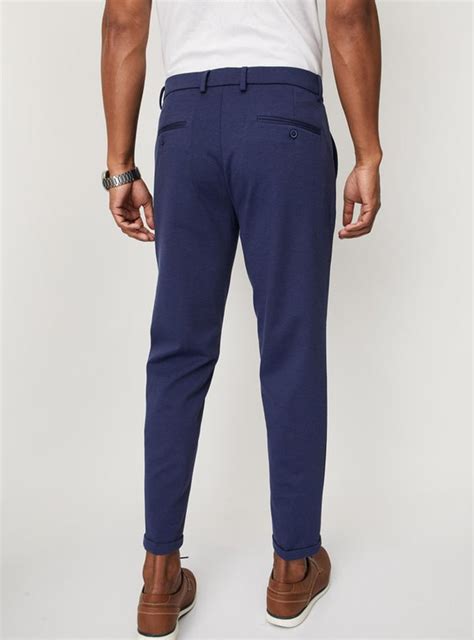 Buy Men Knit Carrot Fit Formal Trousers Online at just Rs. 1499.0 ...