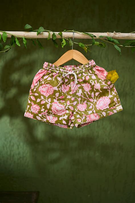 ‘Raindrops keep falling’ kids unisex shorts in green floral hand block ...