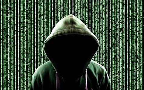 hacker in the mask hacks the program. the digital extortion gets access ...