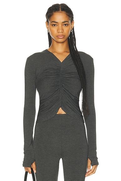Norma Kamali Long Sleeve Turtleneck Skull Cap Catsuit in Black | FWRD