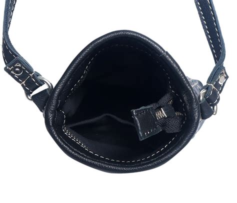 Elegance Redefined: Black Leather Sling Bag with White Stitching. Art ...