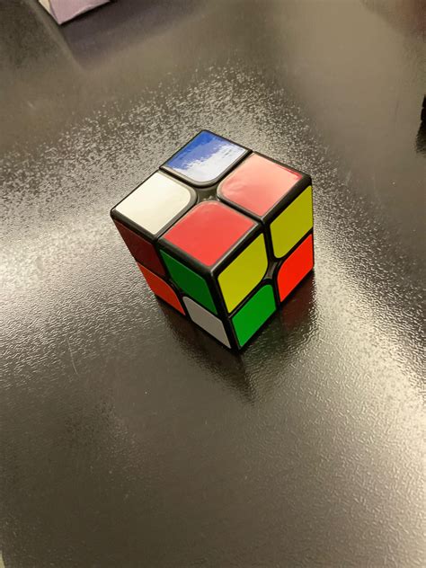 Can anybody help me solve this 2x2 Rubik’s cube? I am a first timer ...