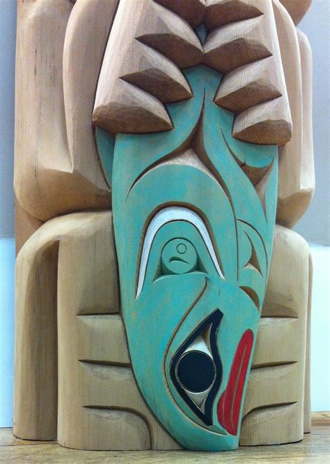 Unleash the Spirit of the Forest: Discover the Majestic Bear Totem Pole