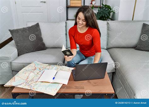 Young Hispanic Woman Holding Canada Passport Looking Map at Home Stock ...