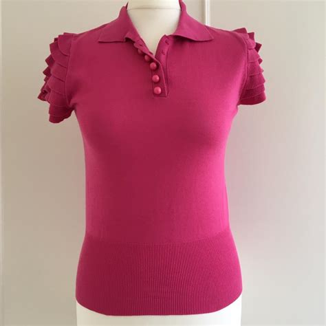 Pink polo with ruffles. 100% cotton. Size S, shown... - Depop