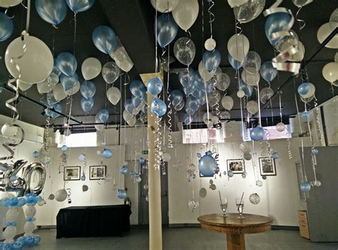 balloons on the ceiling with ribbons hanging at White cloth gallery ...