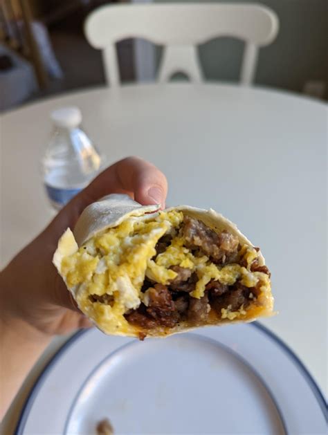 500 calorie breakfast wrap. scrambled eggs, sausage patty and cheese on ...