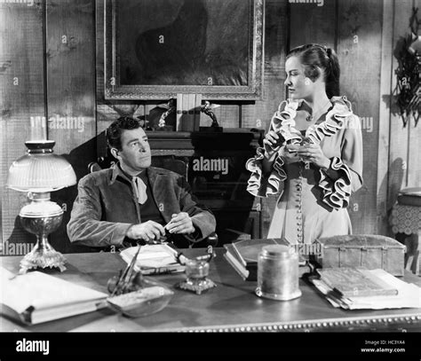 RIDE THE MAN DOWN, from left: Rod Cameron, Ella Raines, 1952 Stock ...