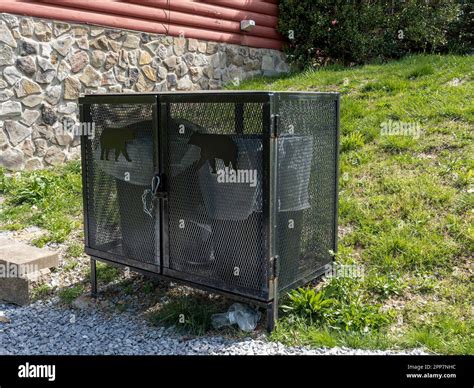 Bear proof garbage can container or anti bear garbage cans next to a ...