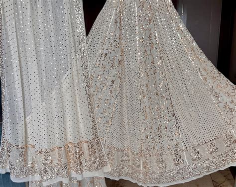 Ruhani heavy badla and mukaish pure georgette lehenga set