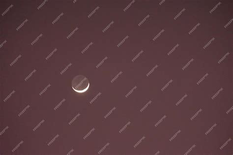 Premium Photo | Crescent moon in the evening sky hilal new moon