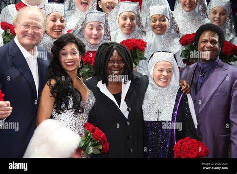 Whoopi Goldberg and cast members posing during the premiere of 'Sister ...