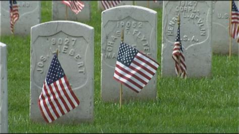 US flags placed on Arlington National Cemetery headstones in honor of ...